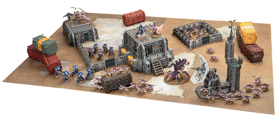 This Combat Patrol battlefield has a central, two story sealed building and then a mixture of three assorted line of sight blocking industrial structures spaced around the corners of the battlefield. It then includes several obstacles, ensuring there are only two medium-sized areas that are clear of terrain which are positioned evenly across the battlefield with sufficient structures around them. This makes it good for matched play as units can deploy safely in their deployment zones, knowing they cannot be shot at in the first turn and there is also space for larger models to manoeuvre.